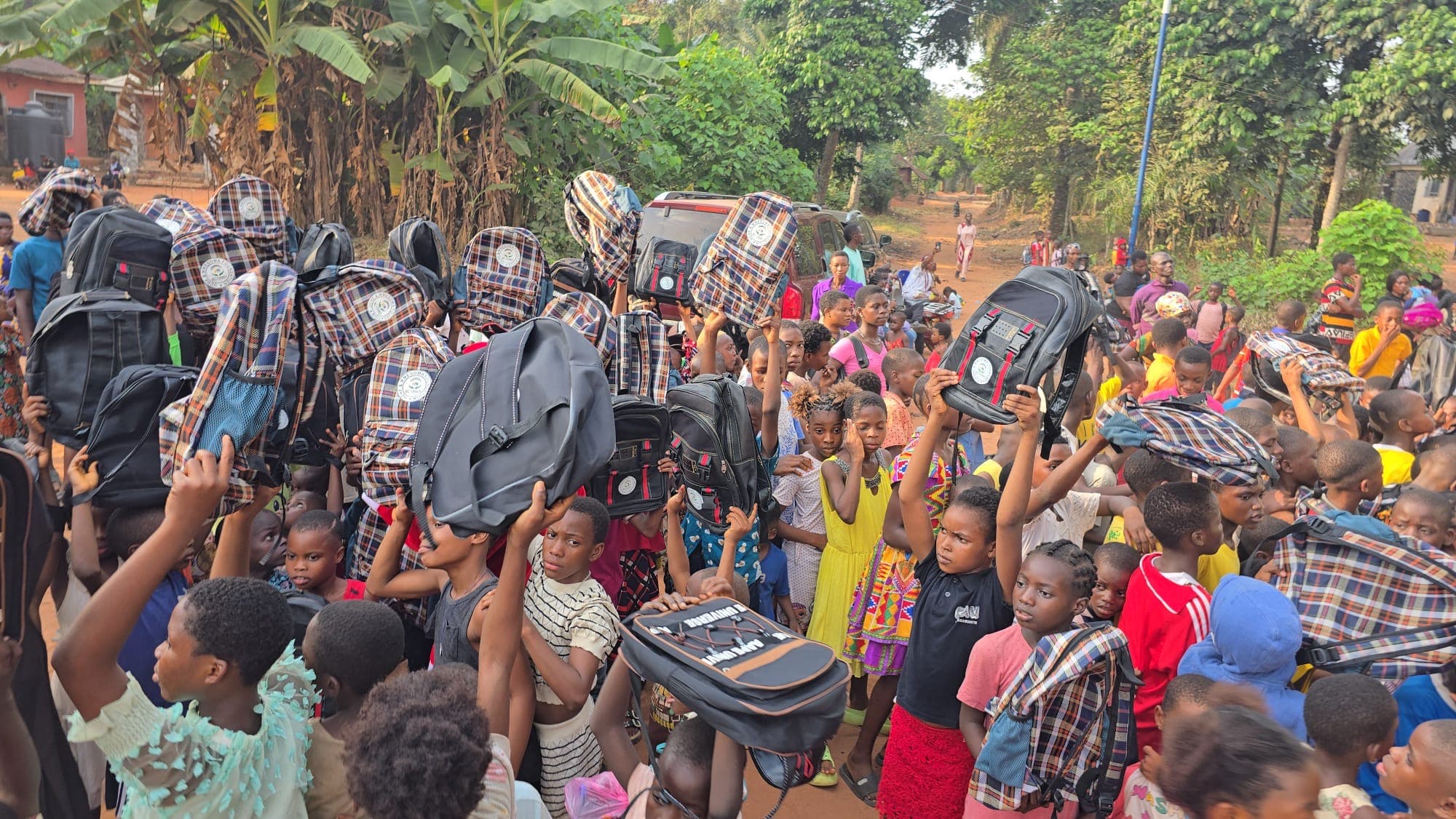 Children celebrating with backpacks